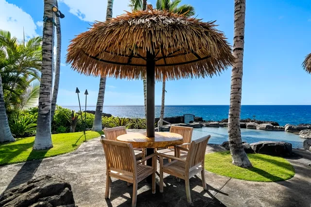a view of a swimming pool and lounge chair