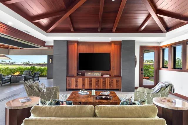 a view of a swimming pool and an outdoor seating