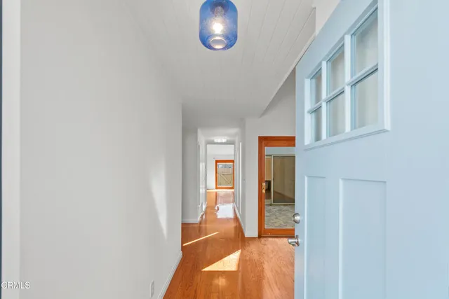 a view of a kitchen with refrigerator and microwave