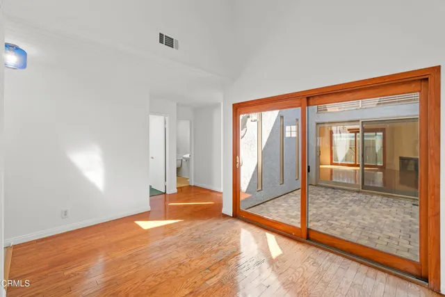 a kitchen with stainless steel appliances granite countertop a stove a sink dishwasher and a refrigerator