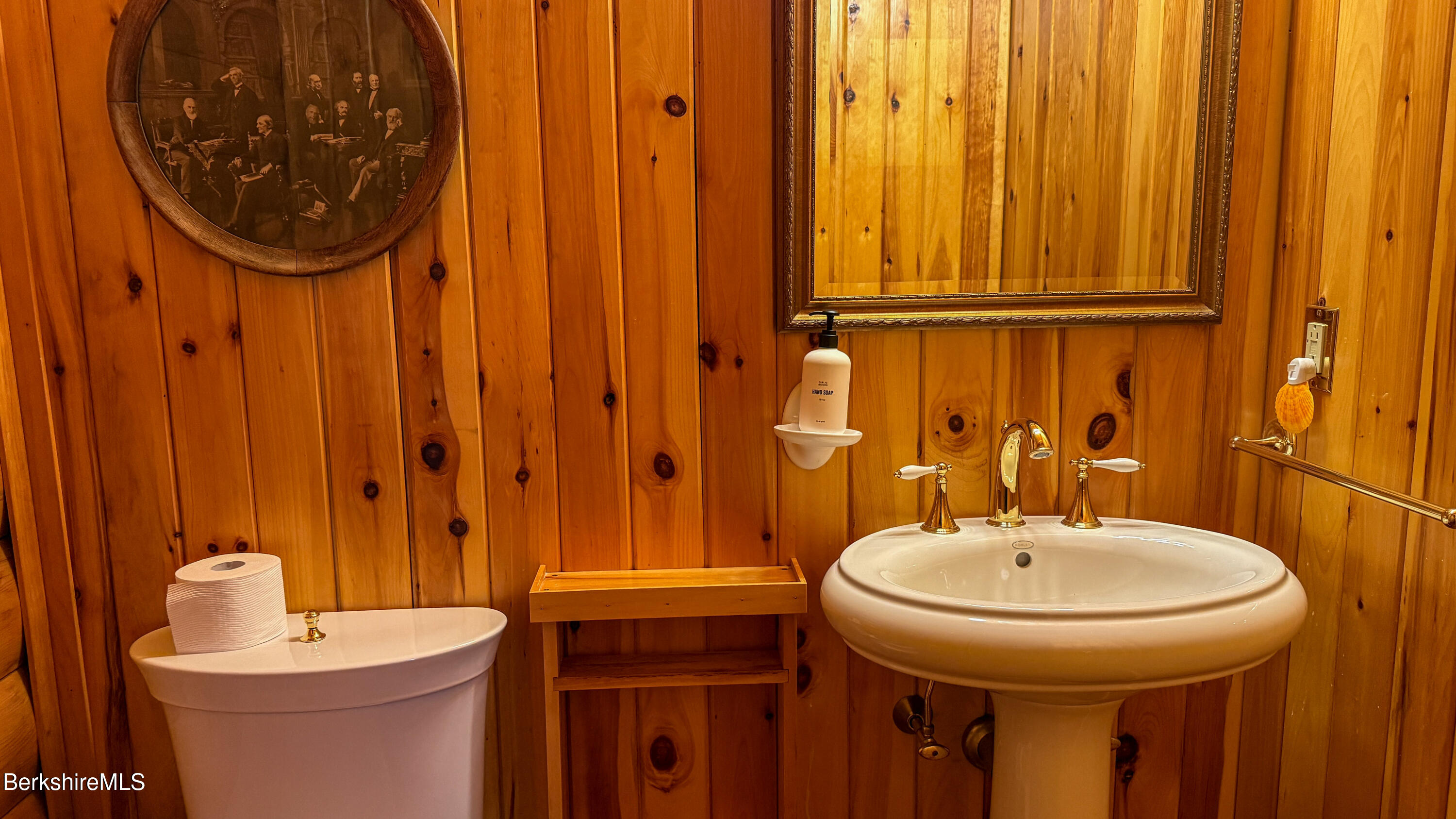 233 Algerie Road Becket, MA 01223 - Photo 23 of 48 a bathroom with a sink a mirror and a toilet