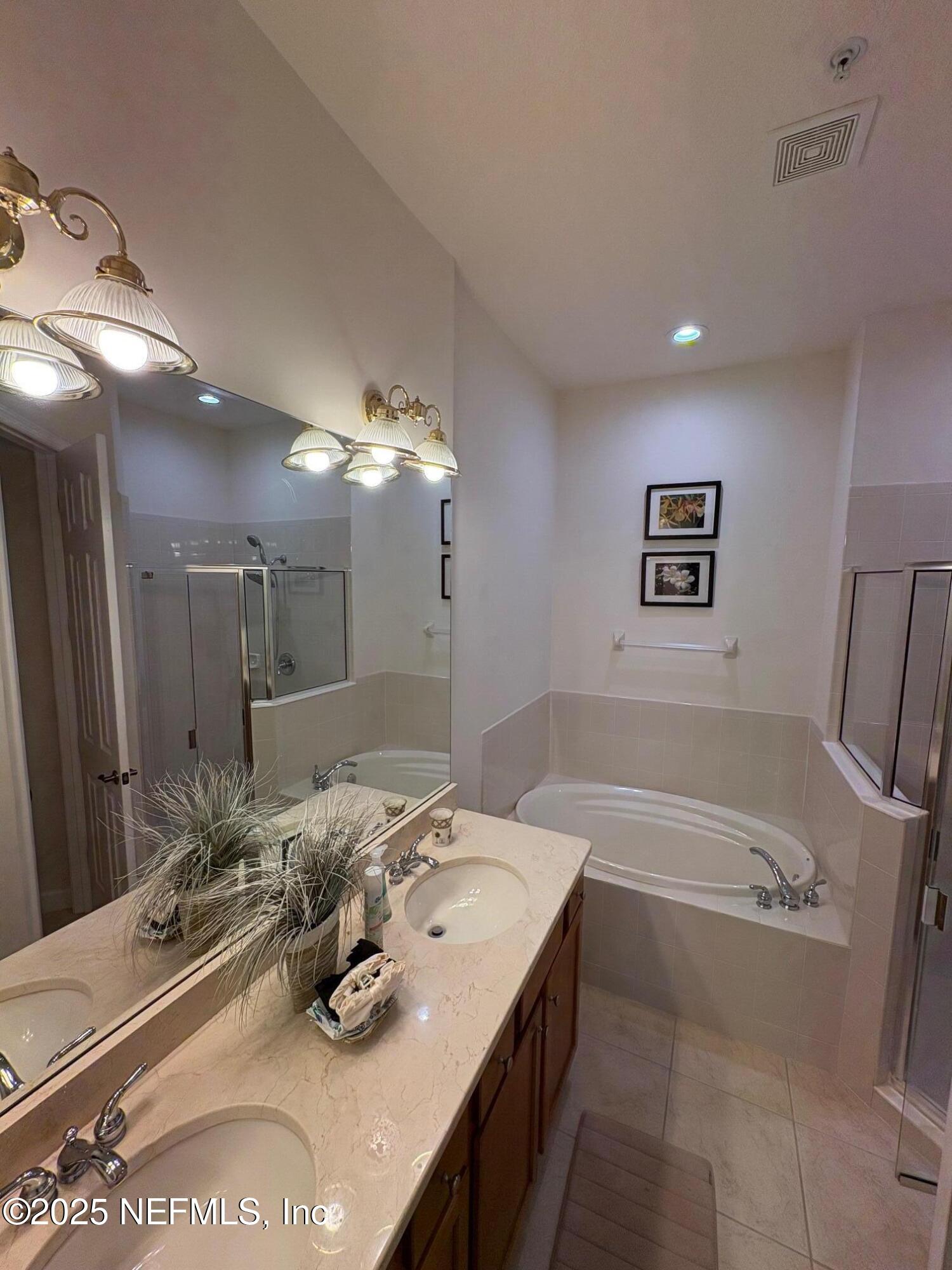 544 Market Street St. Augustine, FL 32095 - Photo 11 of 17 a bathroom with a tub sink and mirror