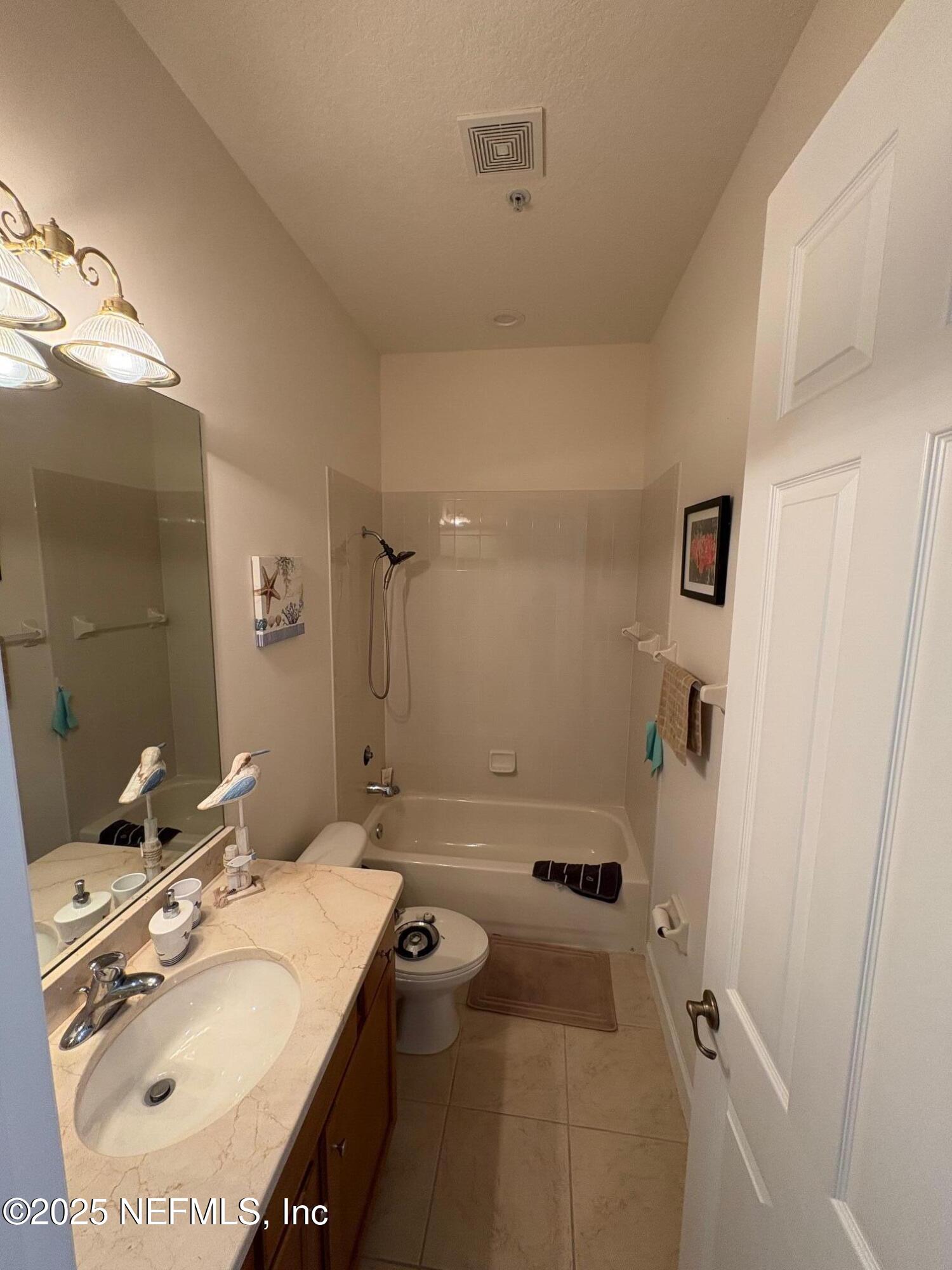 544 Market Street St. Augustine, FL 32095 - Photo 14 of 17 a bathroom with a sink toilet and shower