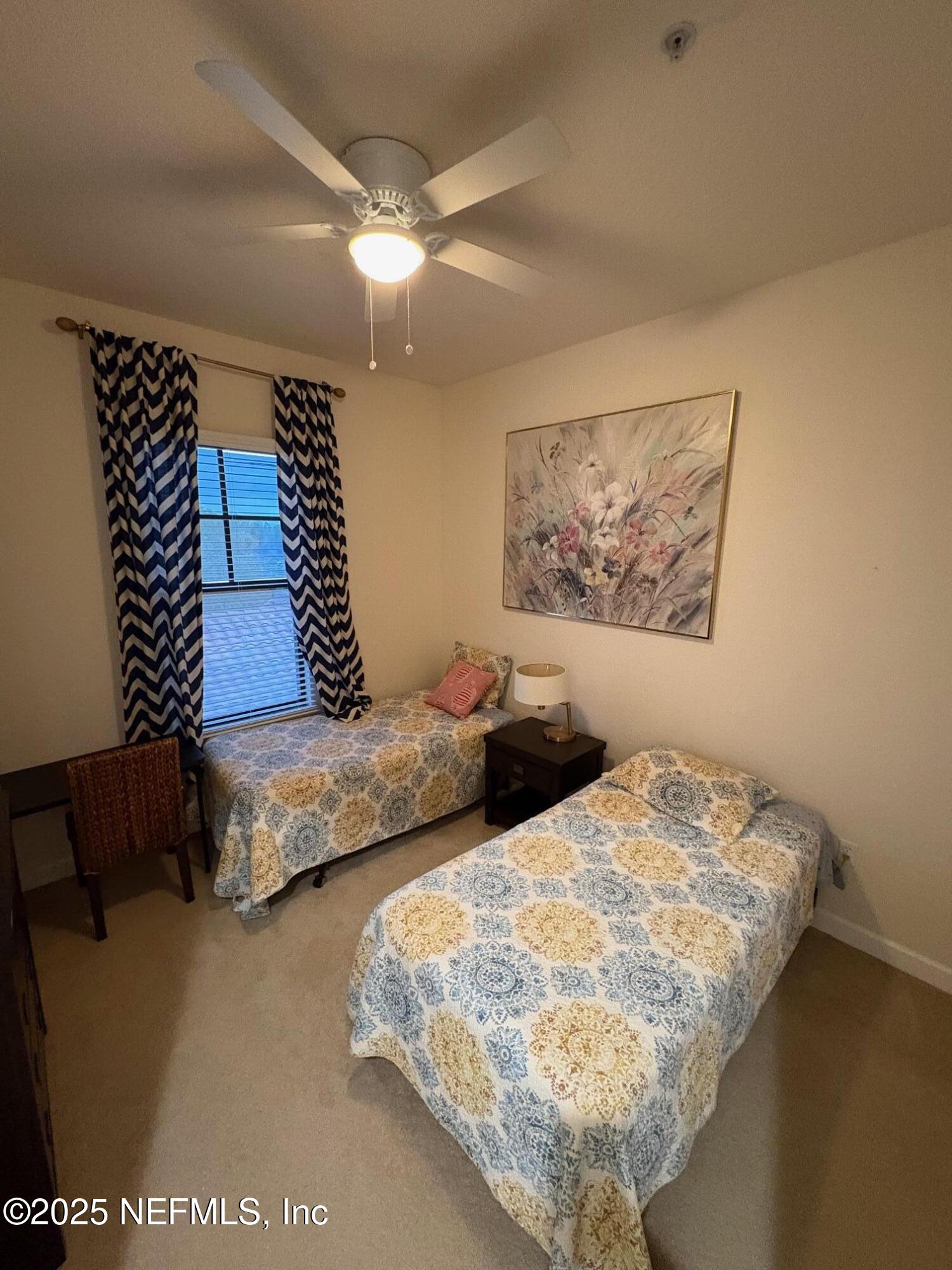 544 Market Street St. Augustine, FL 32095 - Photo 16 of 17 a bedroom with bed and a painting on the wall