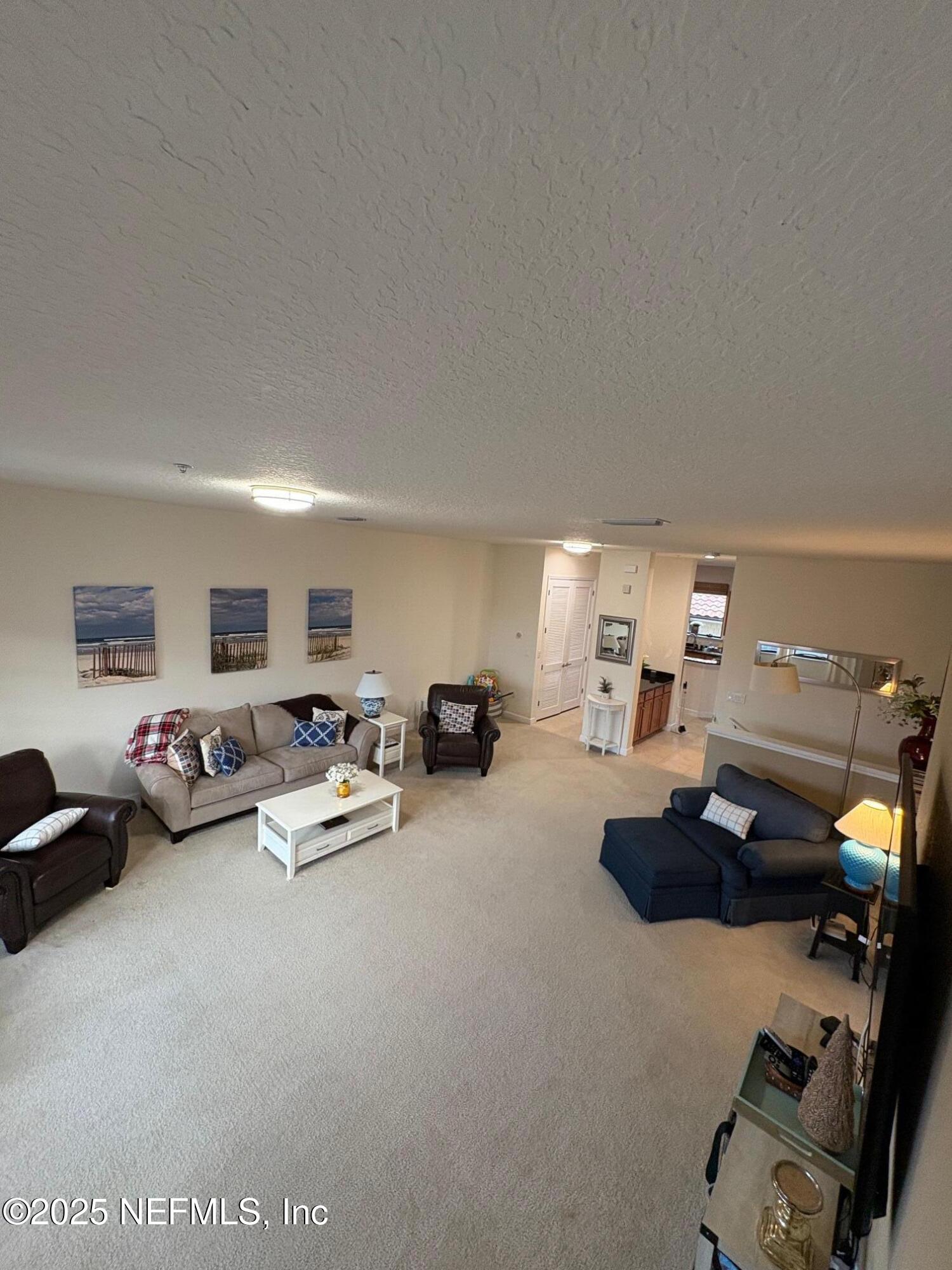 544 Market Street St. Augustine, FL 32095 - Photo 17 of 17 a room with furniture and a flat screen tv