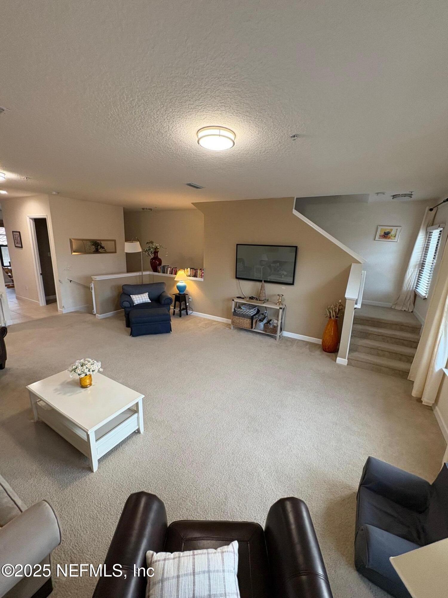 544 Market Street St. Augustine, FL 32095 - Photo 4 of 17 a living room with furniture and a flat screen tv