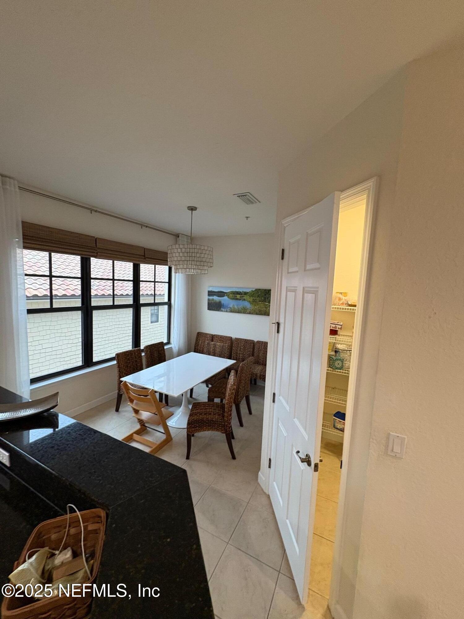 544 Market Street St. Augustine, FL 32095 - Photo 7 of 17 a view of a workspace with furniture and a window