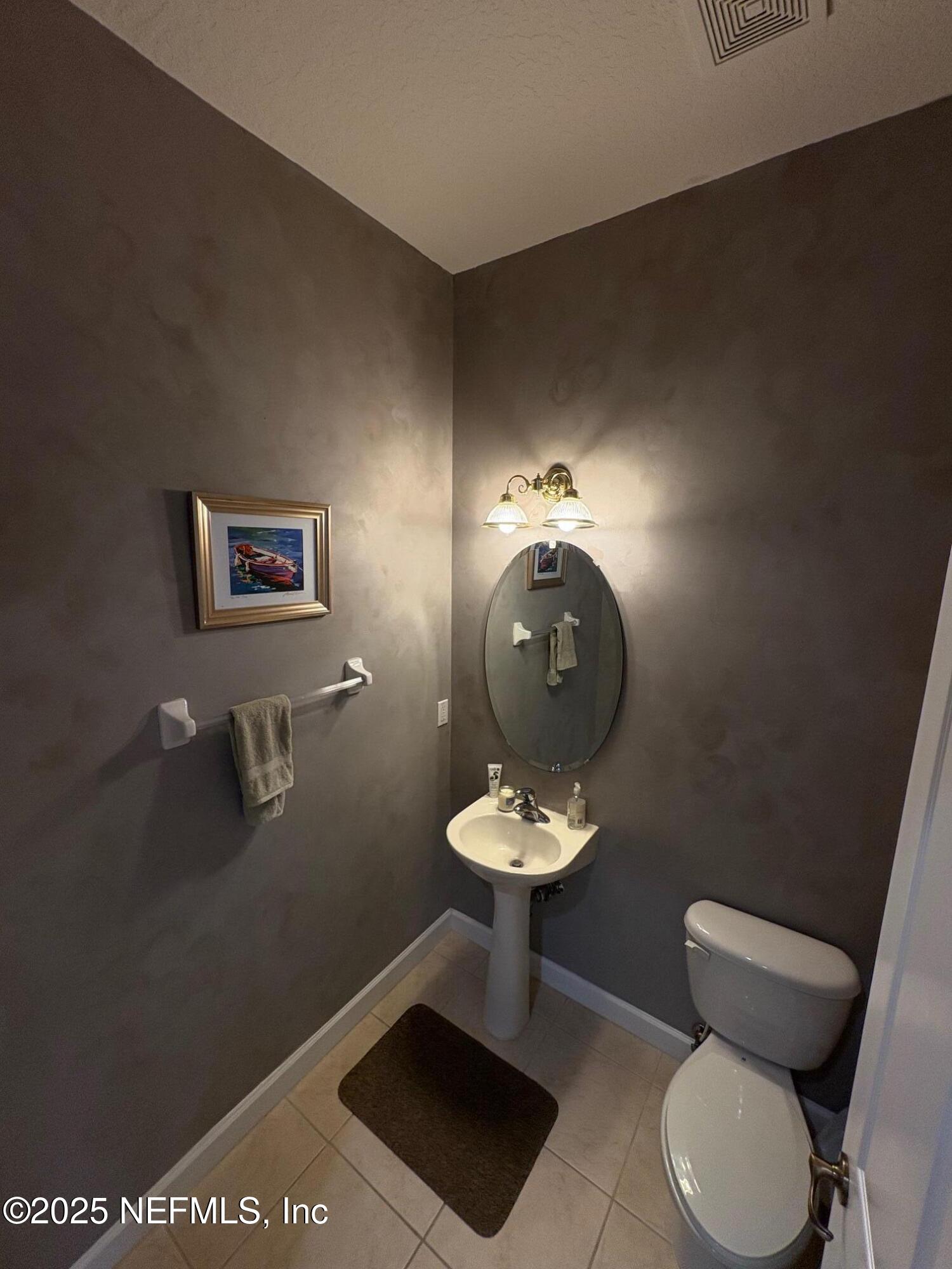 544 Market Street St. Augustine, FL 32095 - Photo 8 of 17 a bathroom with a toilet and a sink