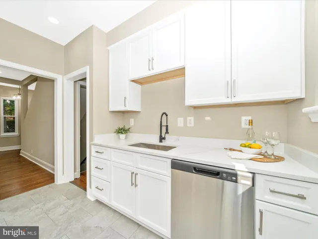 a kitchen that has a table and chairs in it