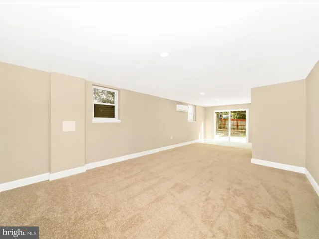 a room with a sink and a mirror