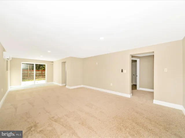 a view of a yard with wooden fence