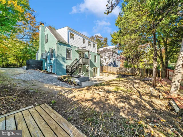 a view of a patio with a table and chairs