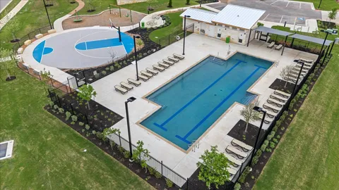 an aerial view of a house with outdoor space