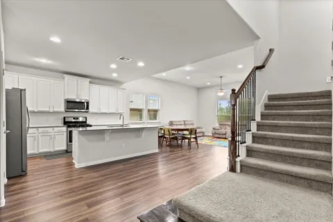 an aerial view of a house with swimming pool and outdoor space