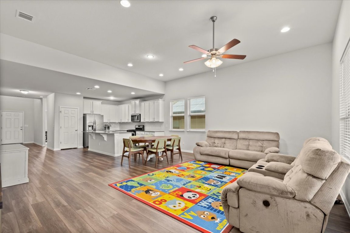 213 Munk Lane Leander, TX 78641 - Photo 15 of 40 a living room with furniture and kitchen view