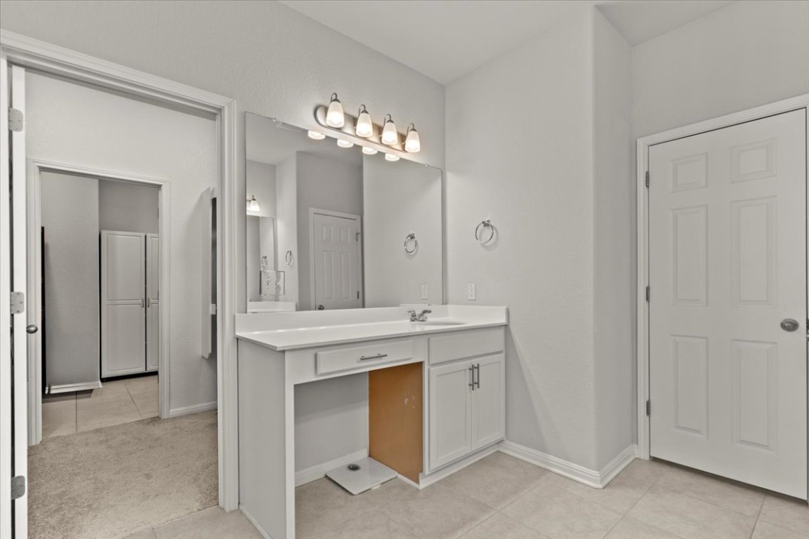 213 Munk Lane Leander, TX 78641 - Photo 20 of 40 a view of a kitchen with a sink and chandelier