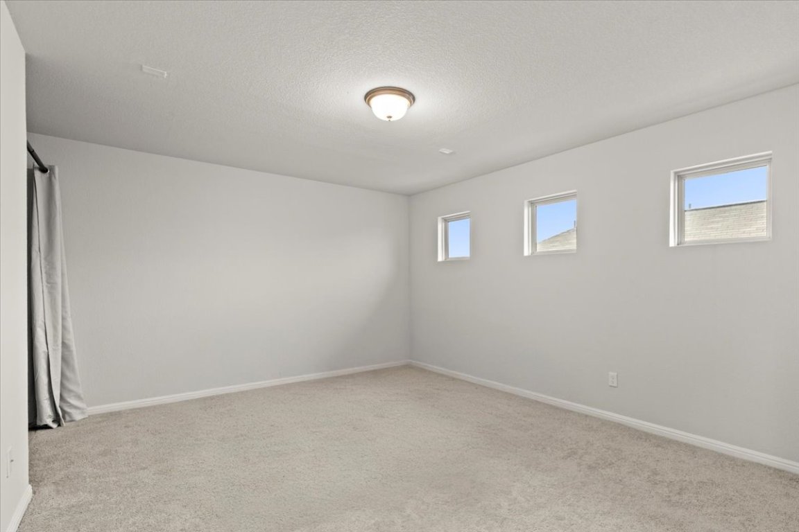 213 Munk Lane Leander, TX 78641 - Photo 23 of 40 an empty room with a empty space and window