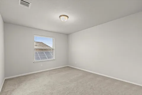 an empty room with a empty space and window