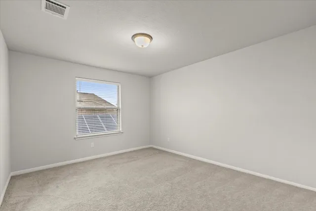 an empty room with a empty space and window