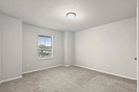 a bathroom with a toilet a sink a mirror and vanity