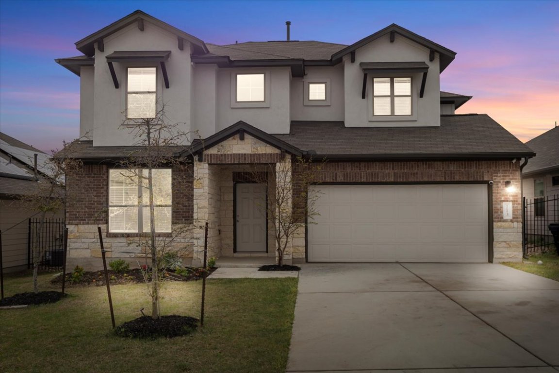 213 Munk Lane Leander, TX 78641 - Photo 4 of 40 a front view of a house with garden