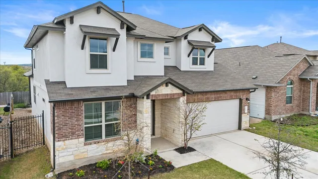 a front view of a house with garage