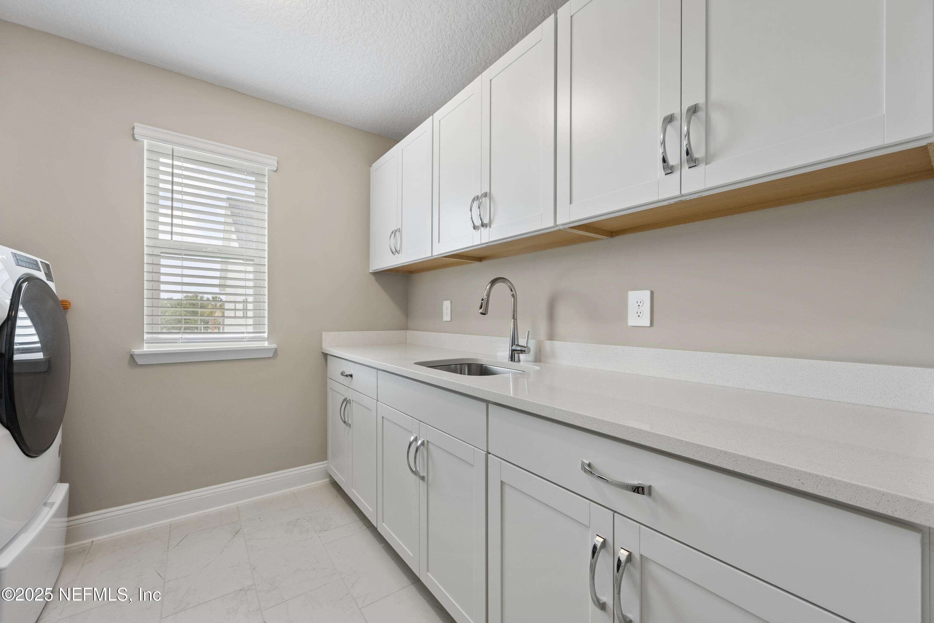 205 Seaside Vista Court St. Augustine, FL 32084 - Photo 18 of 35 Laundry Folding Table