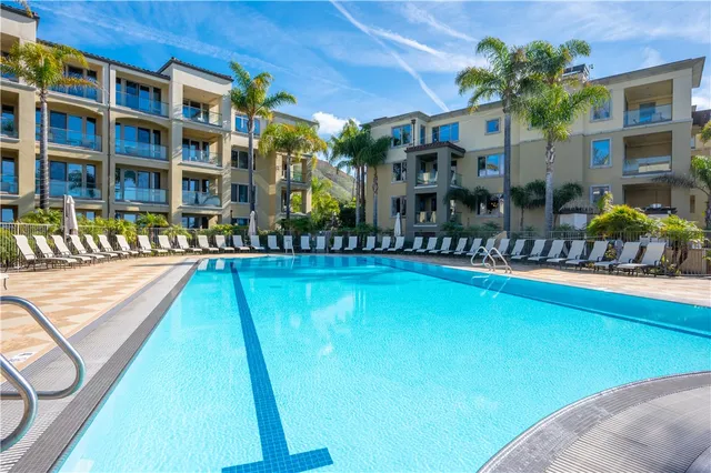 a view of swimming pool with outdoor seating