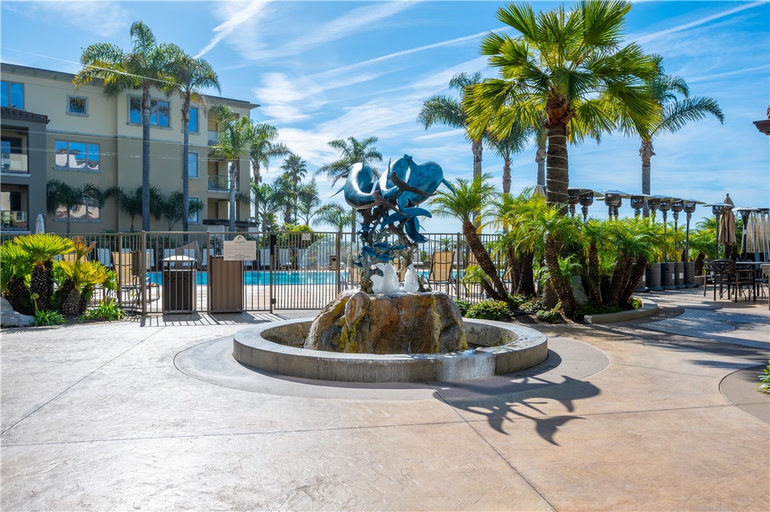 2727 Shell Beach Road, Unit 219 Pismo Beach, CA 93449 - Photo 24 of 35 a vase of flowers sitting on a floor in front of a building