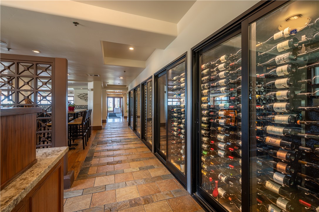 2727 Shell Beach Road, Unit 219 Pismo Beach, CA 93449 - Photo 29 of 35 a hallway with wooden floor and windows