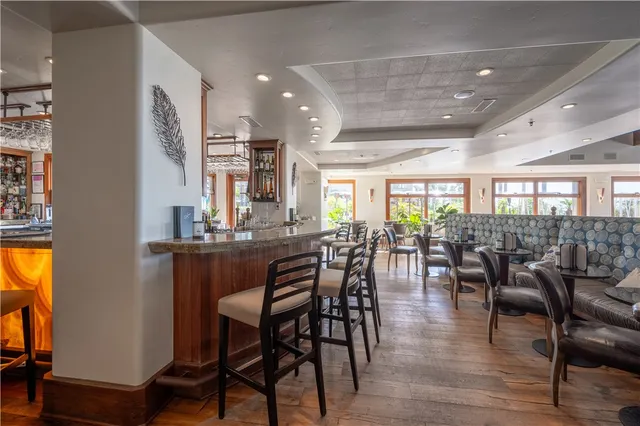 a view of a backyard with a patio table and chairs