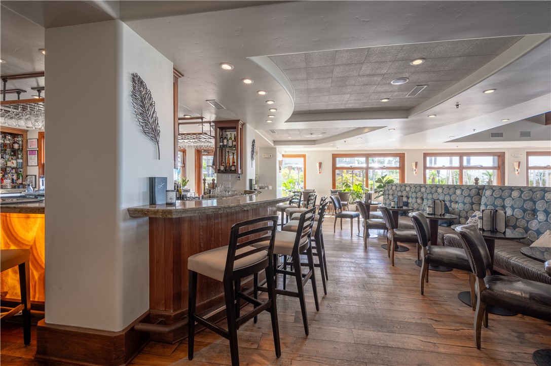 2727 Shell Beach Road, Unit 219 Pismo Beach, CA 93449 - Photo 30 of 35 a view of a dining room with furniture and wooden floor