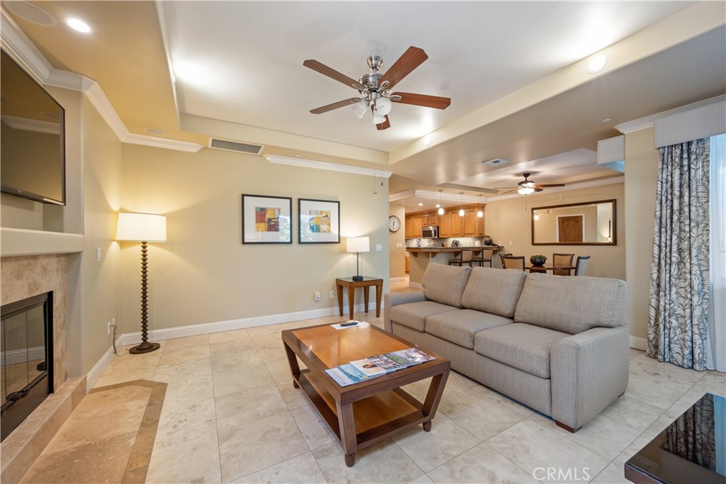 2727 Shell Beach Road, Unit 219 Pismo Beach, CA 93449 - Photo 7 of 35 a living room with furniture and a fireplace