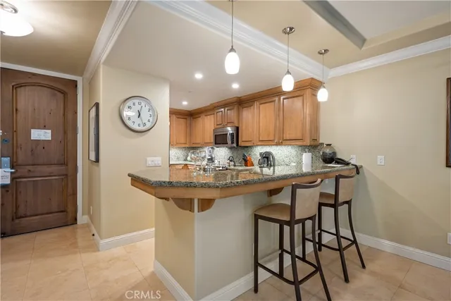 a kitchen with a sink cabinets and window