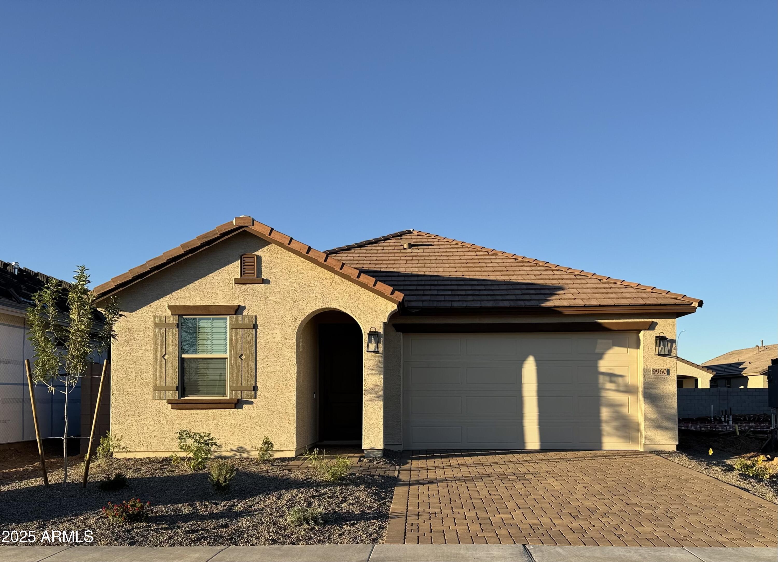 9960 West Mitchell Avenue Avondale, AZ 85392 - Photo 1 of 25 a front view of a house