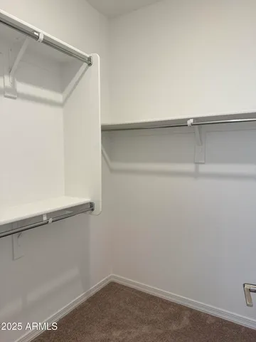 a view of an empty walk in closet