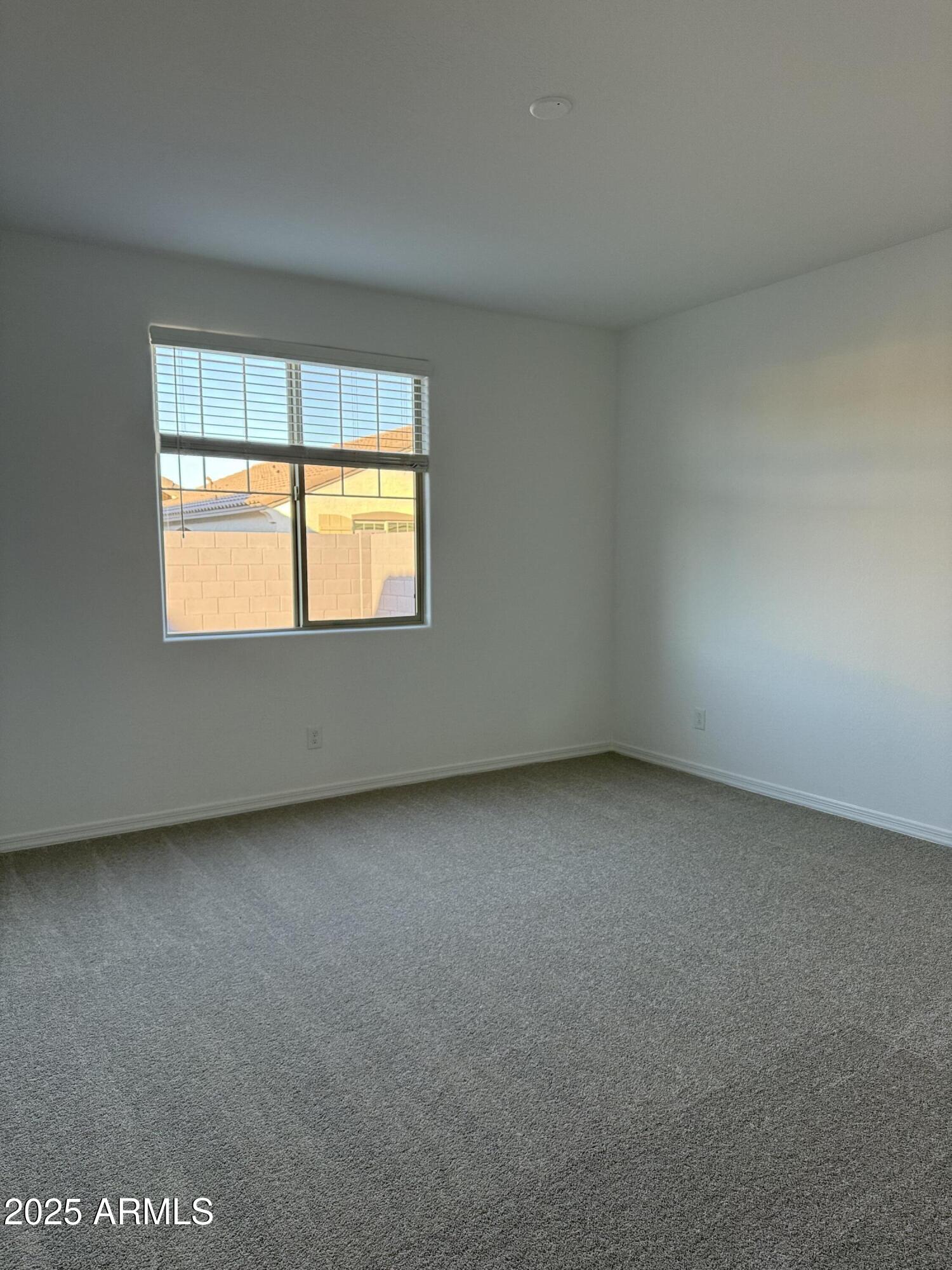 9960 West Mitchell Avenue Avondale, AZ 85392 - Photo 9 of 25 an empty room with a window