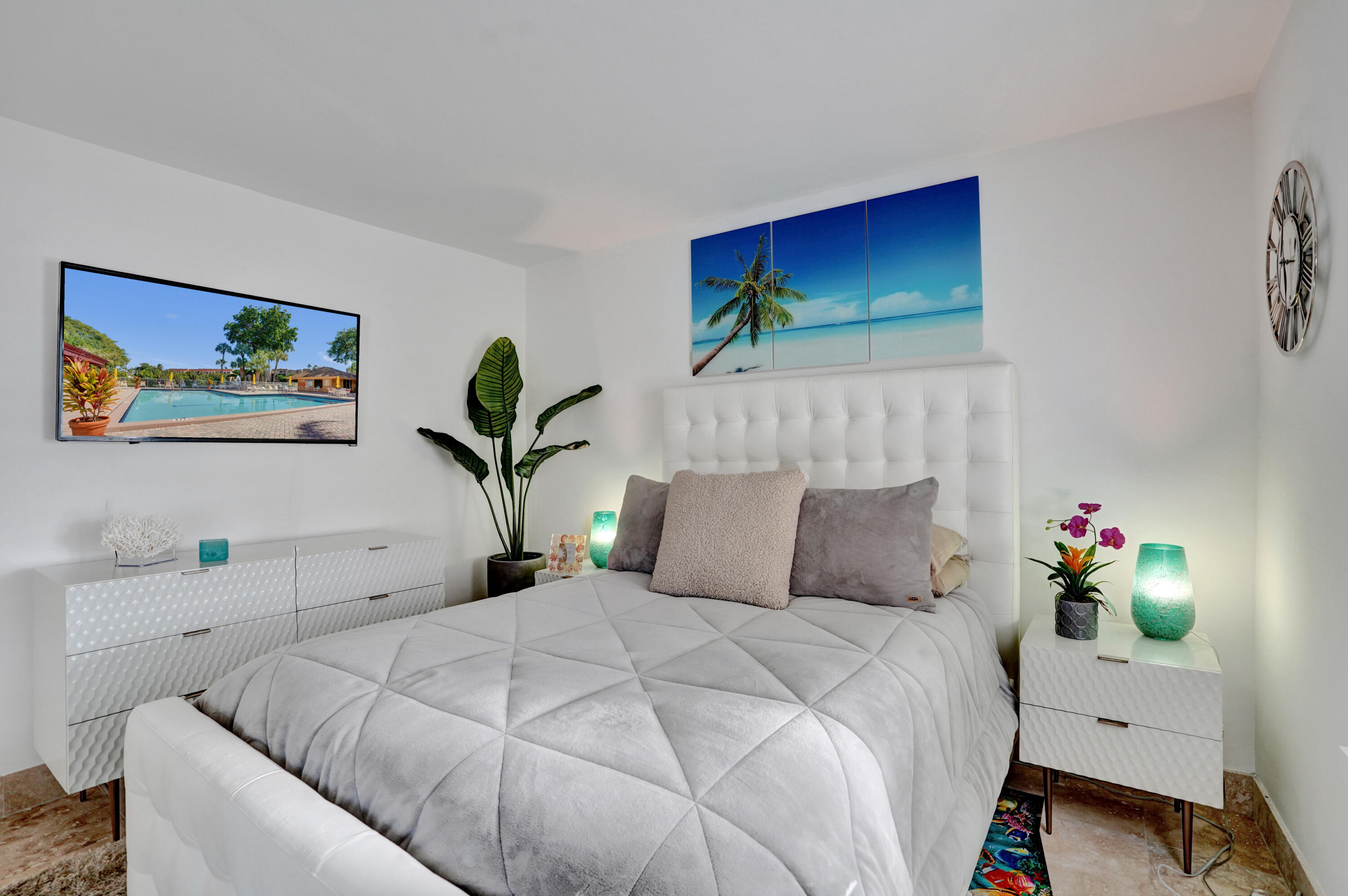 755 Dotterel Road, Unit 1112 Delray Beach, FL 33444 - Photo 31 of 64 a bedroom with a bed and furniture