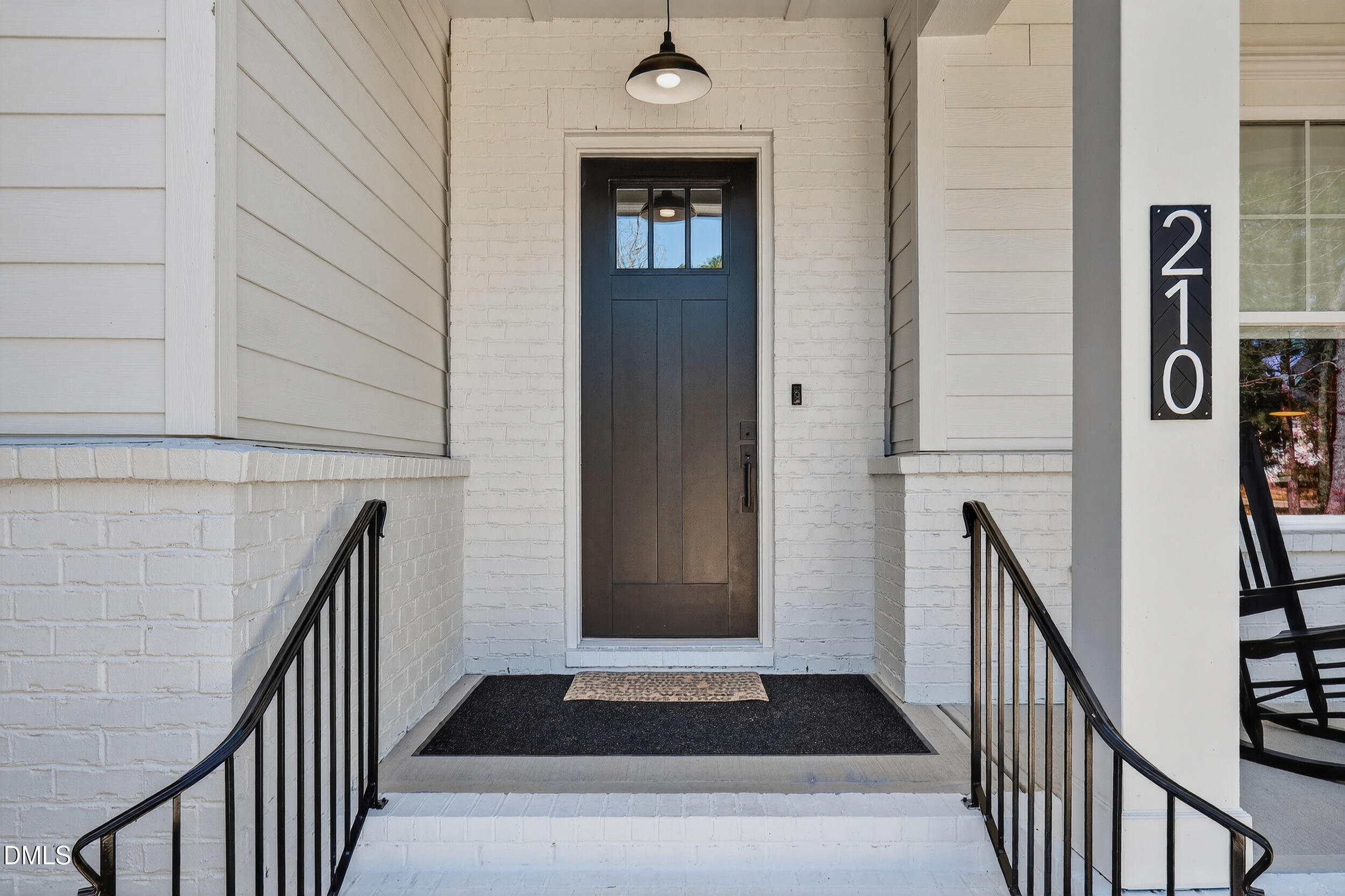 210 Lookout Ridge Pittsboro, NC 27312 - Photo 7 of 59 a view of entryway with a front door and wooden floor