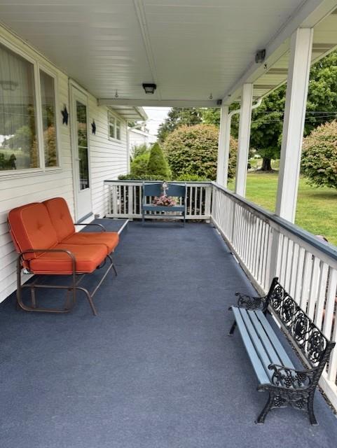 3938 Station Road New Castle, PA 16101 - Photo 16 of 23 an outdoor sitting area with couch and wooden fence