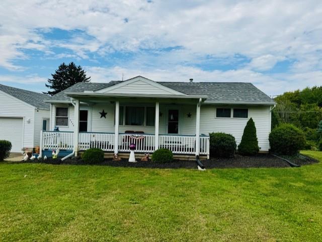 3938 Station Road New Castle, PA 16101 - Photo 21 of 23 a front view of a house with a garden and trees