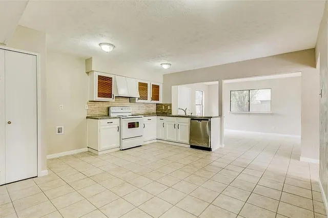 a kitchen with stainless steel appliances cabinets and a sink