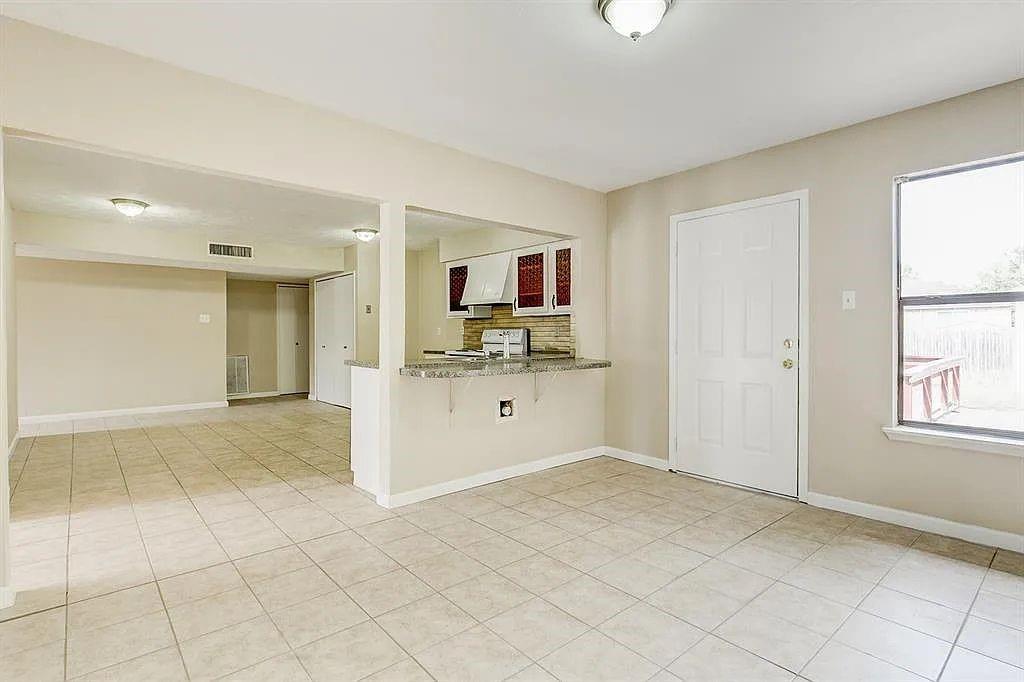 1316 Royster Road Fort Worth, TX 76134 - Photo 8 of 19 a view of a kitchen with cabinet and window