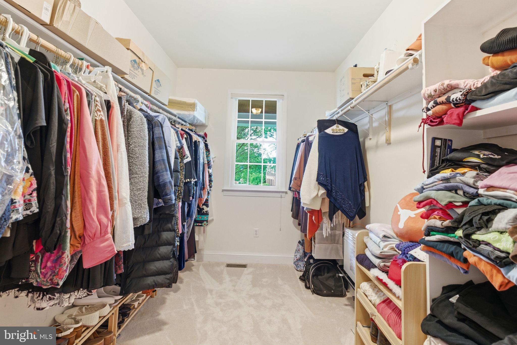 9 Deer Ridge Court Phoenix, MD 21131 - Photo 46 of 96 a view of walk in closet with clothes