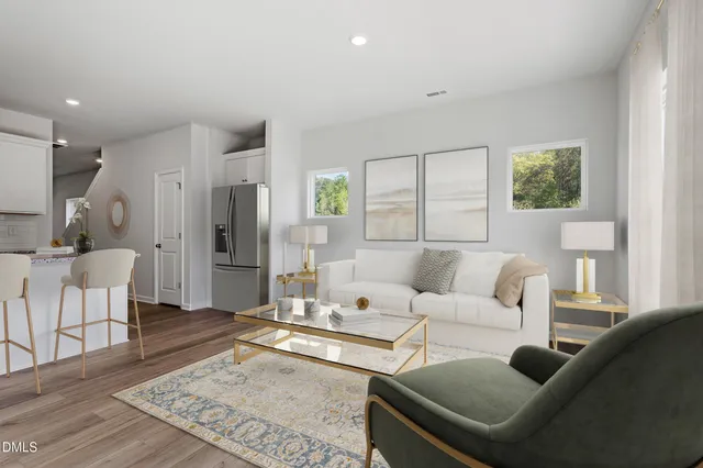 a living room with furniture and a rug