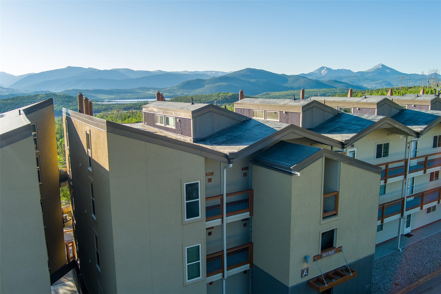 7031 Ryan Gulch Road, Unit 301 Silverthorne, CO 80498 - Photo 33 of 37 a front view of a house with a mountain