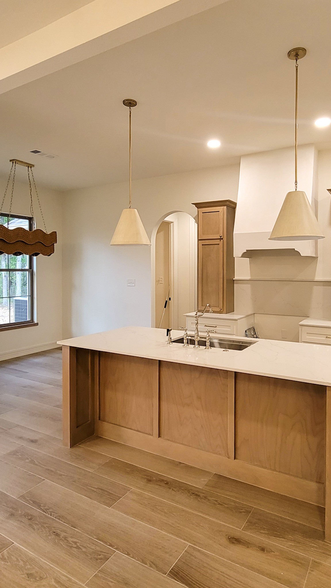 6202 Johnson Road Orange, TX 77632 - Photo 11 of 26 a view of a kitchen with a sink and wooden floor
