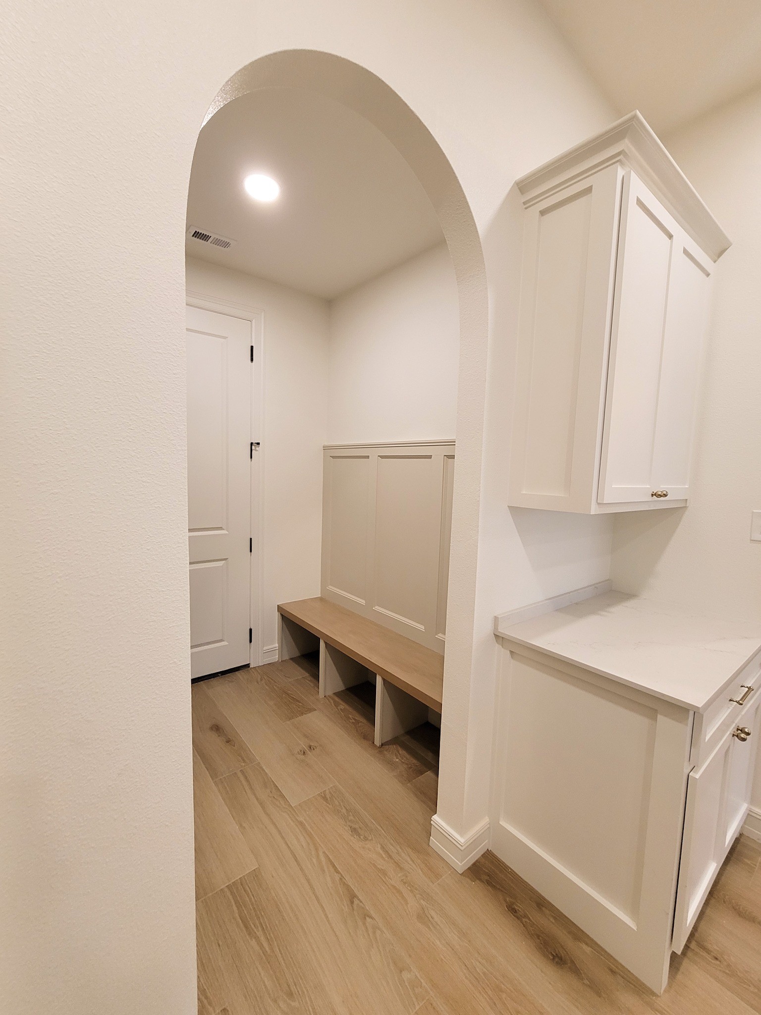 6202 Johnson Road Orange, TX 77632 - Photo 13 of 26 a view of a room with wooden floor and white cabinet