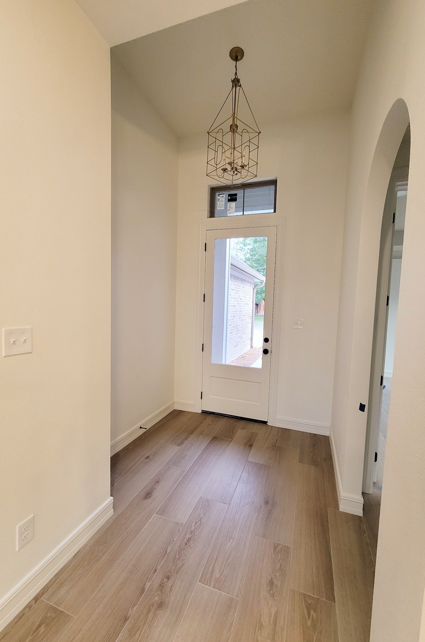6202 Johnson Road Orange, TX 77632 - Photo 20 of 26 an empty room with wooden floor and hallway