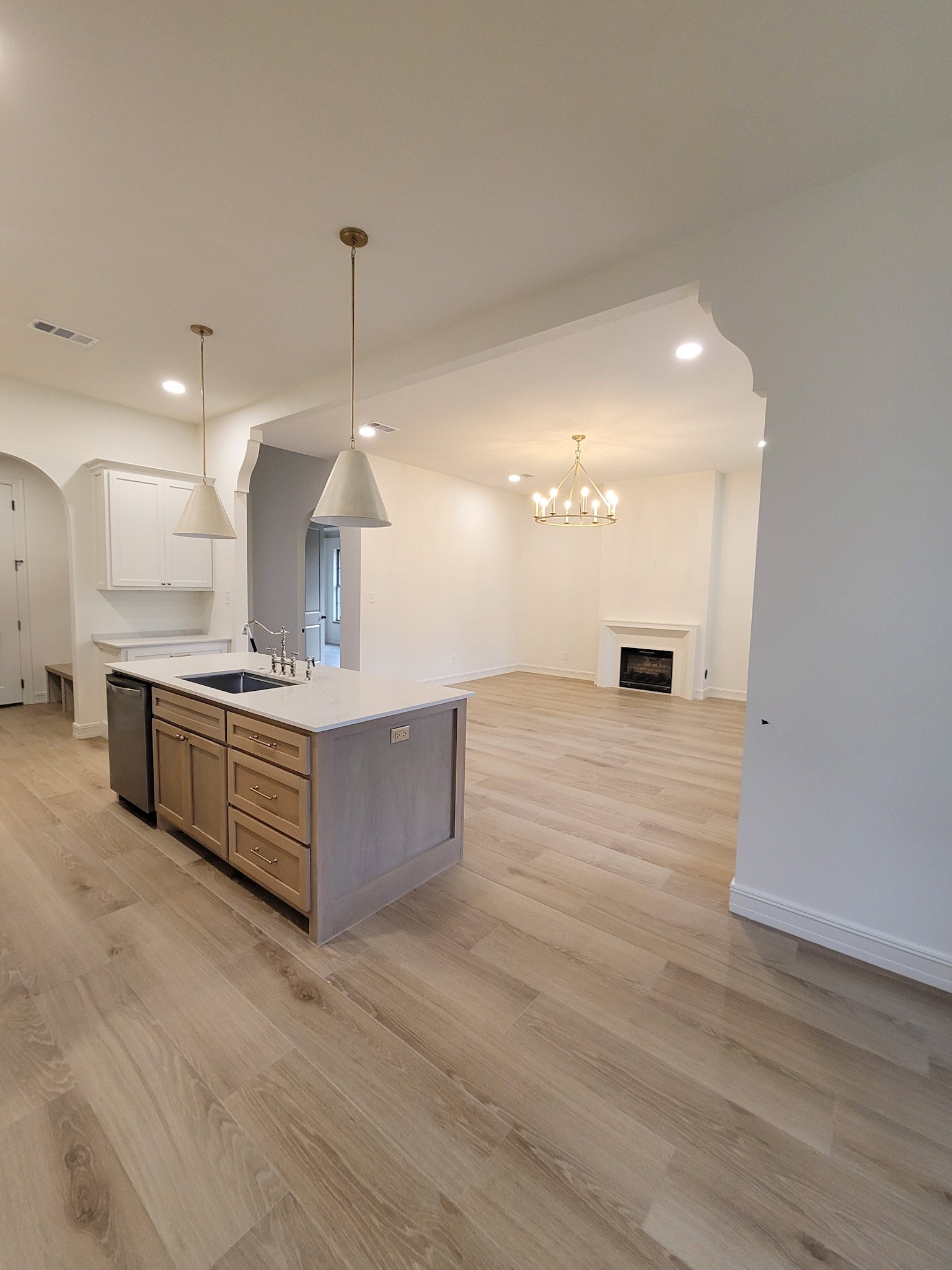 6202 Johnson Road Orange, TX 77632 - Photo 6 of 26 a large kitchen with kitchen island a sink stainless steel appliances and cabinets